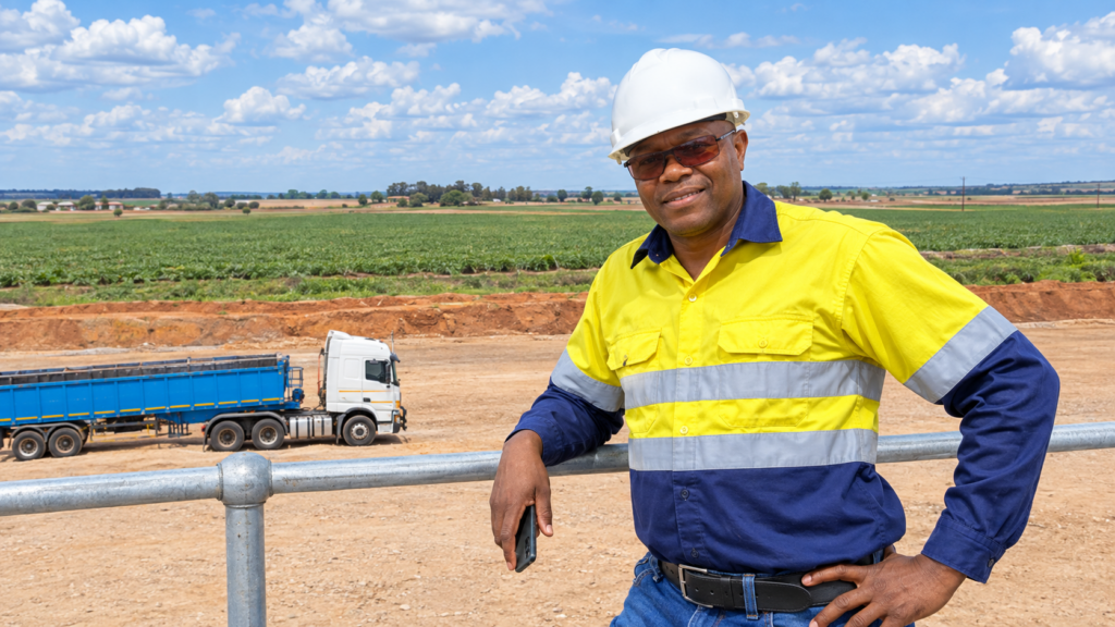 Babenakwena Mining founder on site with a coal haulage truck in the background